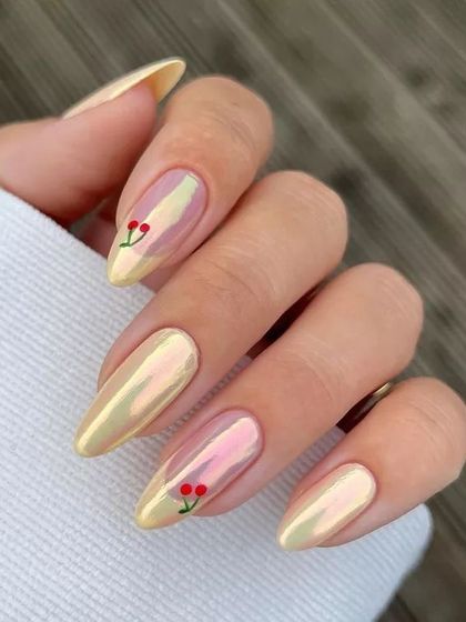 A playful and trendy design combining a pearlescent chrome finish with cute, hand-painted cherry details. This look is perfect for summer and shows how you can mix different finishes for a fun result.