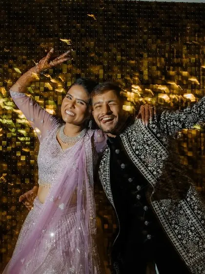 Pure fun and energy on the dance floor. This shot captures the couple's joyful and carefree spirits during their Sangeet performance.