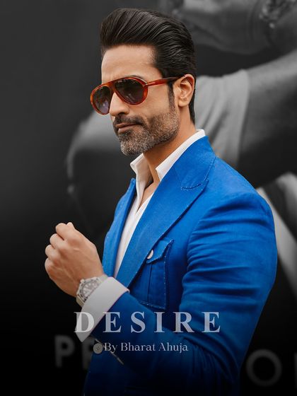 Confidence tailored to perfection. This shot captures the sharp silhouette and vibrant color of the blue blazer, a piece that commands attention.