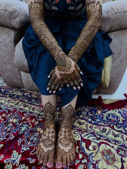 A complete bridal look is essential. Here you can see how I coordinate the intricate designs on the hands and feet, ensuring a beautiful, cohesive look for the bride.