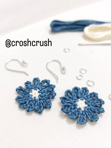 Dainty and elegant micro-crochet flower earrings in a beautiful shade of teal with a cream center.