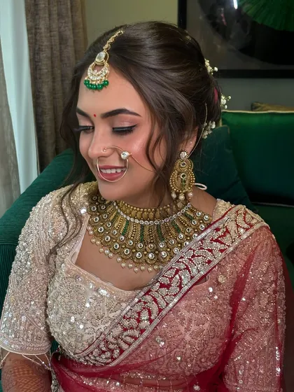 A close-up of the hairstyle, showing the texture and volume created to achieve this elegant look.