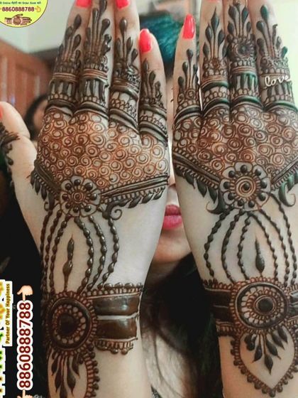 A beautiful jewellery-style mehndi design. The patterns mimic bracelets and hand chains, creating a very delicate and elegant look.