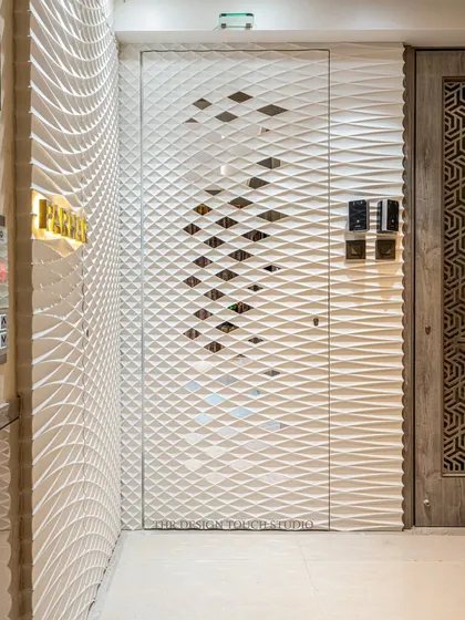 A detailed shot of the Corian door, showing the precision of the 3D wavy texture and the subtle cutouts that add depth. This design is perfect for clients who appreciate modern minimalism and clever design.