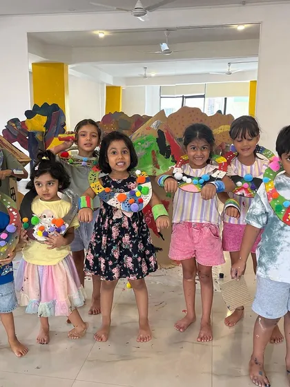Look at these proud creators showing off the unique necklaces they made. In our workshops, there's no single "right" way to do things. Each child's creation is a reflection of their own imagination, building their confidence and celebrating their individuality.
