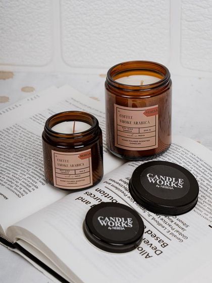 Here is another shot of my "Coffee Smoke Arabica" jar candles. I love how they look on a stack of books, making them not just a source of fragrance but also a stylish decor accessory.