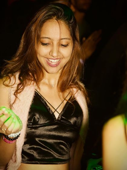 A guest smiling and enjoying the music.