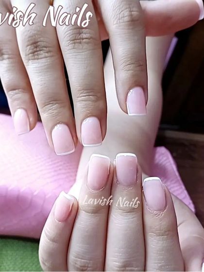 A very natural and subtle French manicure on short, square nails, perfect for a minimalist bride who wants a polished look.
