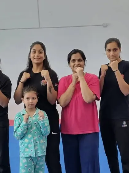Our female instructors and trainees, including a young girl, showcasing the supportive environment.