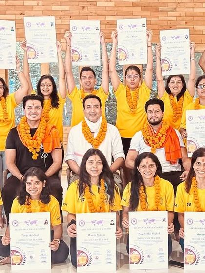 Our proud graduates of the 300-hour YTTC, holding their certificates high after an intensive journey of learning and self-discovery.
