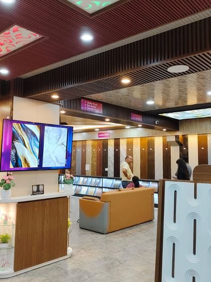 Our digital screens display a slideshow of completed projects and design ideas, providing you with even more inspiration during your visit.