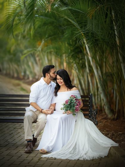 Another tender kiss, this time with the mom to be holding a bouquet. This classic pose is always beautiful for capturing the love between expecting parents.