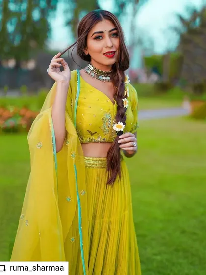 For this festive Baisakhi look, I styled influencer Ruma Sharma in a vibrant lime-green lehenga. The styling focuses on a fresh, modern Indian aesthetic, complete with a braided hairstyle and delicate floral details.