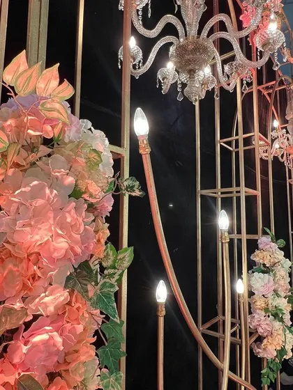 The intricate metalwork and floral details of the stage backdrop, which we designed and fabricated for the 60th birthday party.