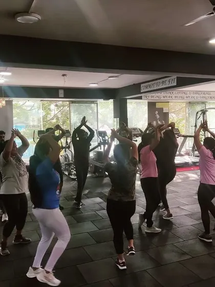 The group learning a new routine. We keep the choreography simple and fun so everyone can follow along.