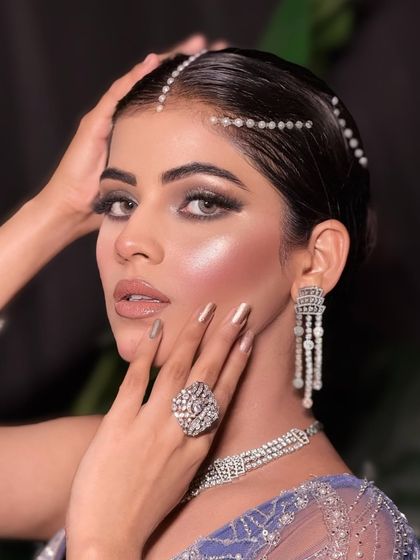 Serving gemstone glam. This close-up shows the detailed eye makeup and the beautiful, glowing skin.