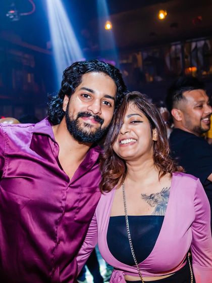 A couple posing for a photo.