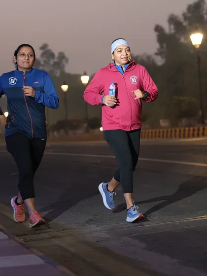 Two runners pacing each other. The buddy system helps in maintaining pace and motivation.