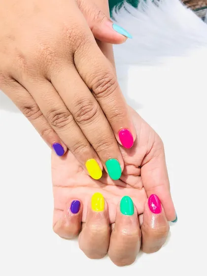 Another look at the fun, multi-colored "skittles" manicure.