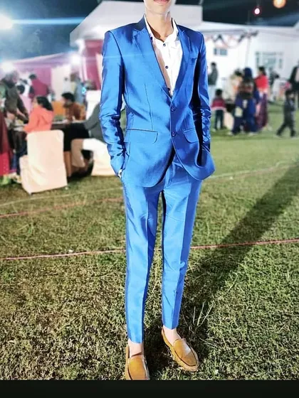 This client is ready for a wedding party in a vibrant blue two piece suit I stitched. The slim fit and sharp cut ensure a modern and celebratory look.