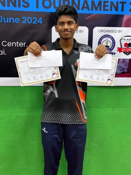 Yashwin Gade holds his certificates after winning first place in U-19 Boys and second place in U-17 Boys at the District Ranking Tournament.