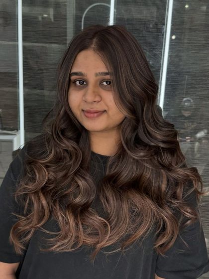 A full view of the Chestnut Brown hair color. This look combines a darker root with warm, blended highlights for a style that is both trendy and easy to maintain.