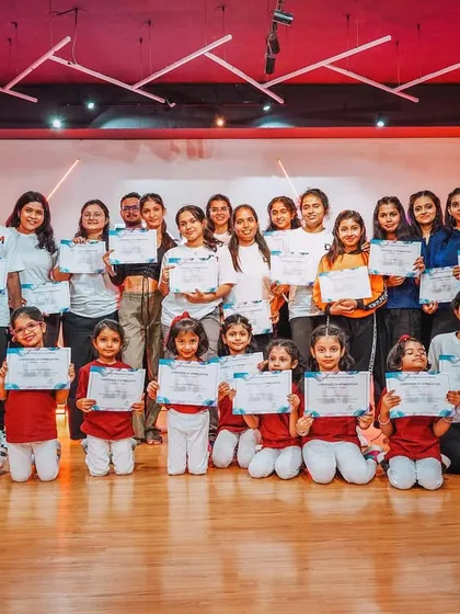 The full crew of performers at our Studio Showcase 2024. This group photo captures the joy and sense of accomplishment of our junior, senior, and adult dancers.