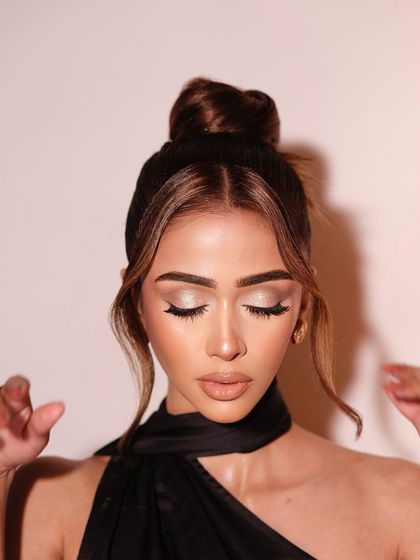 The soft, shimmery eyeshadow is the focus of this elegant shot.