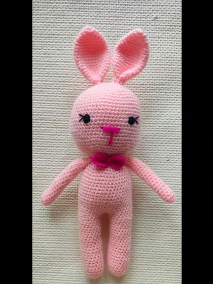 A cute pink bunny with a little bow tie. This amigurumi toy is handmade by me and makes a very pretty gift.