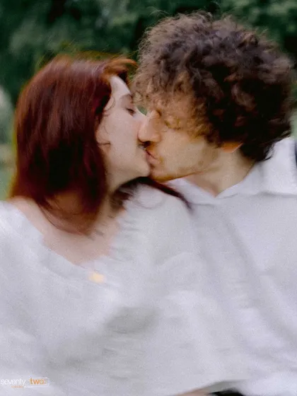 A dreamy, motion-blurred kiss. This artistic shot conveys the whirlwind of emotions and the deep passion of their commitment to each other.
