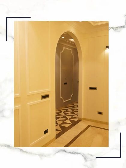 An arched entryway with intricate flooring, demonstrating how every detail in our homes whispers elegance and craftsmanship.