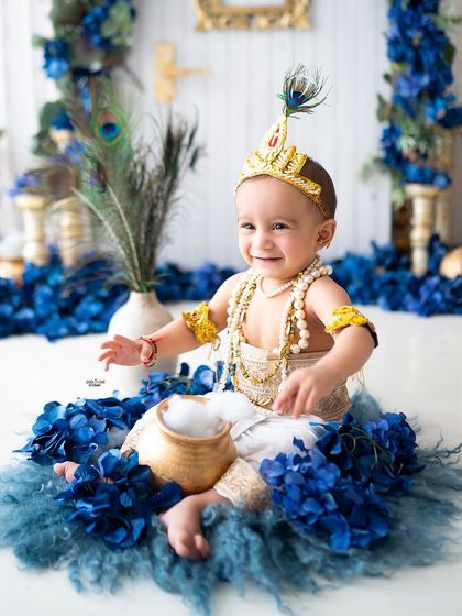 This little Krishna is having fun with his pot of 'makhan' (butter).