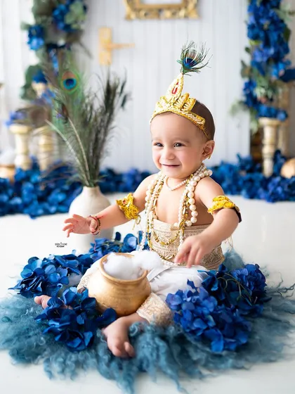 This little Krishna is having fun with his pot of 'makhan' (butter).
