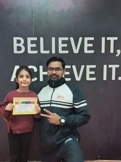 A peace sign from the coach to celebrate this student's new certificate.