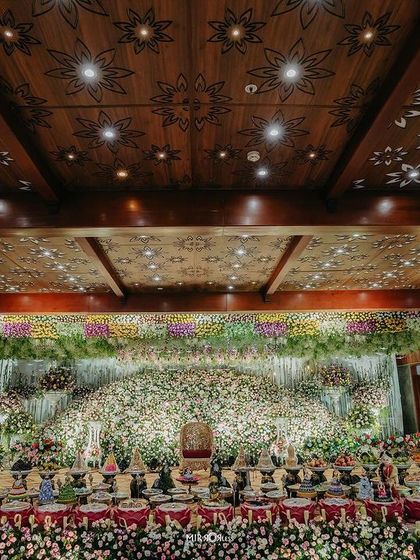 A repeat of the grand floral stage with the carved wood ceiling, showing its impressive scale.