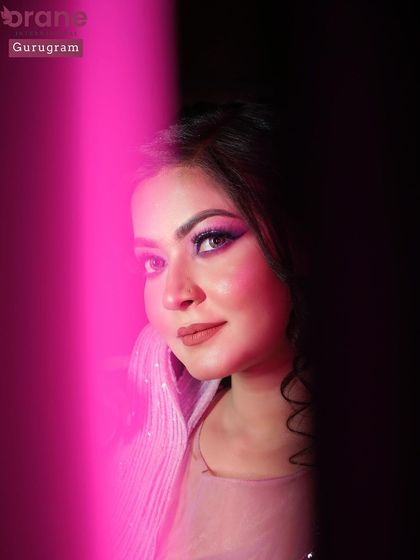 An artistic shot of the lavender look using colored lighting. This shows the creative photography techniques I incorporate into our portfolio shoots.