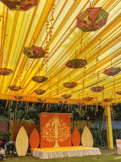 A Haldi ceremony should be full of joy and color. We created this vibrant canopy with bright yellow drapes and decorated it with traditional Rajasthani umbrellas and marigold garlands, setting the perfect mood for the celebration.