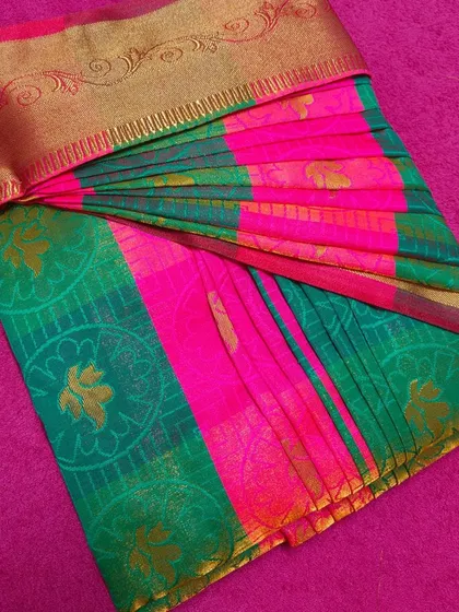 A top-down view of a perfectly box-folded saree. This technique is a game-changer for saree lovers who want to keep their collection organized.