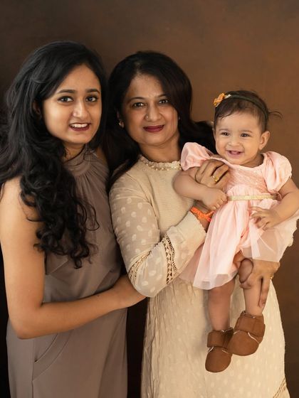 Three generations of women, one unbreakable legacy. A grandmother, mother, and baby girl together, celebrating the strength and love passed down through family.