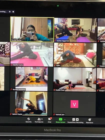 Here I am, taking a moment to capture my amazing students during a deep stretching session. It's so inspiring to see everyone committed to their practice, bending and breathing together.