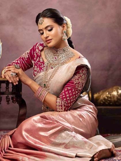 A timeless and regal pose. This bride's look for Varamahalakshmi features a soft, glowing makeup style that enhances her features while complementing her traditional attire.