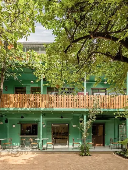 The Subko Ajji House project involved creating a modern coffee house within a traditional courtyard setting. I used a distinct color palette and materials that respect the existing structure while establishing a fresh, contemporary identity.