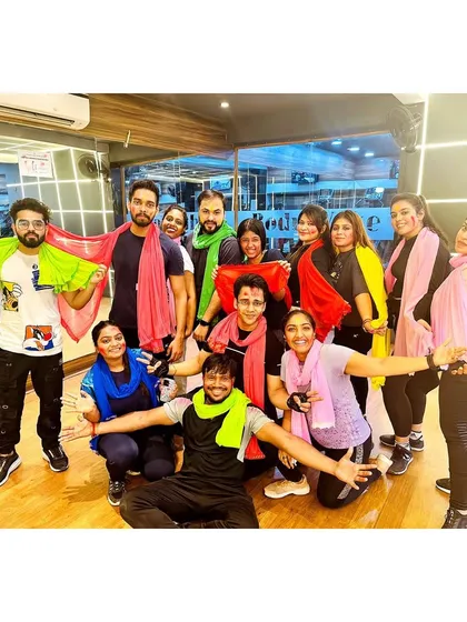 Fitness is a celebration here. This is a glimpse of our tribe during a special Holi-themed workout, because we believe in having fun while we grind.
