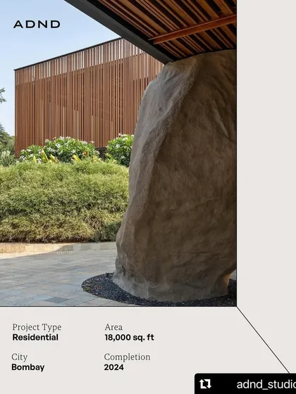 A massive, sculptural rock anchors the drop-off area at K House. We often use large, natural elements like this to create a powerful sense of place and a memorable first impression.