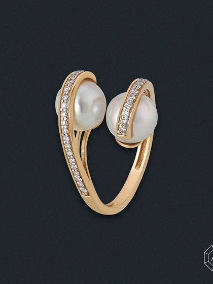 A reflection of your impeccable taste. This 14kt gold ring features two lustrous cultured pearls embraced by sparkling round diamonds, perfect for turning everyday moments into something remarkable.