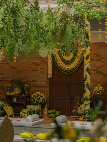 I believe pre-wedding decor can be as grand and thoughtful as the main event. Here, we created a South Indian temple-inspired setting with lush floral torans and traditional elements for a truly breathtaking and sophisticated atmosphere.