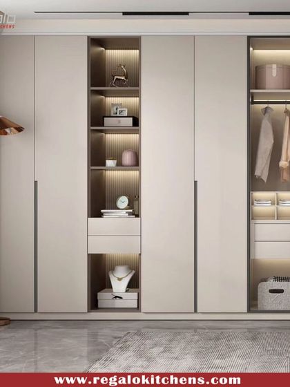 A minimalist design featuring handleless doors and an open, illuminated central shelving unit. This creates a beautiful focal point while providing easy access to frequently used items.