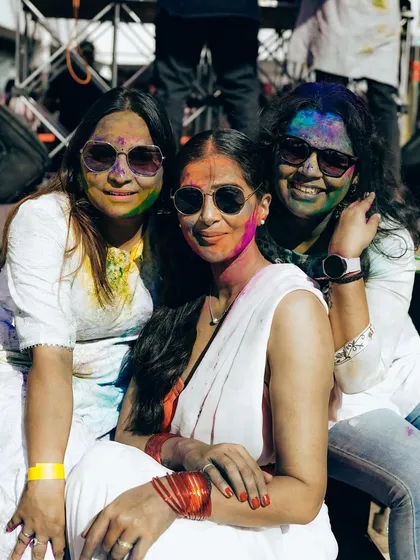 Friends posing for a photo at the High Ultra Lounge Holi event. Our parties are the perfect backdrop for creating and capturing great memories.