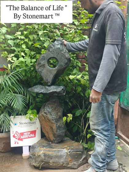 One of our artisans making a final adjustment to the 'Balance of Life' sculpture. This piece is a testament to our commitment to creating extraordinary, large-scale abstract art for discerning clients.