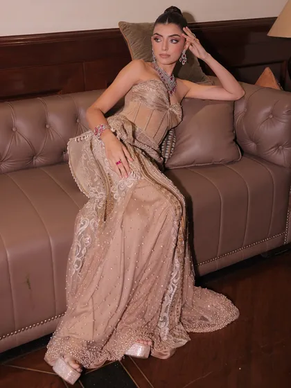 The champagne silk gown, a piece imagined with its wearer in mind, crafted to honor life’s milestones with beauty that feels both personal and enduring.